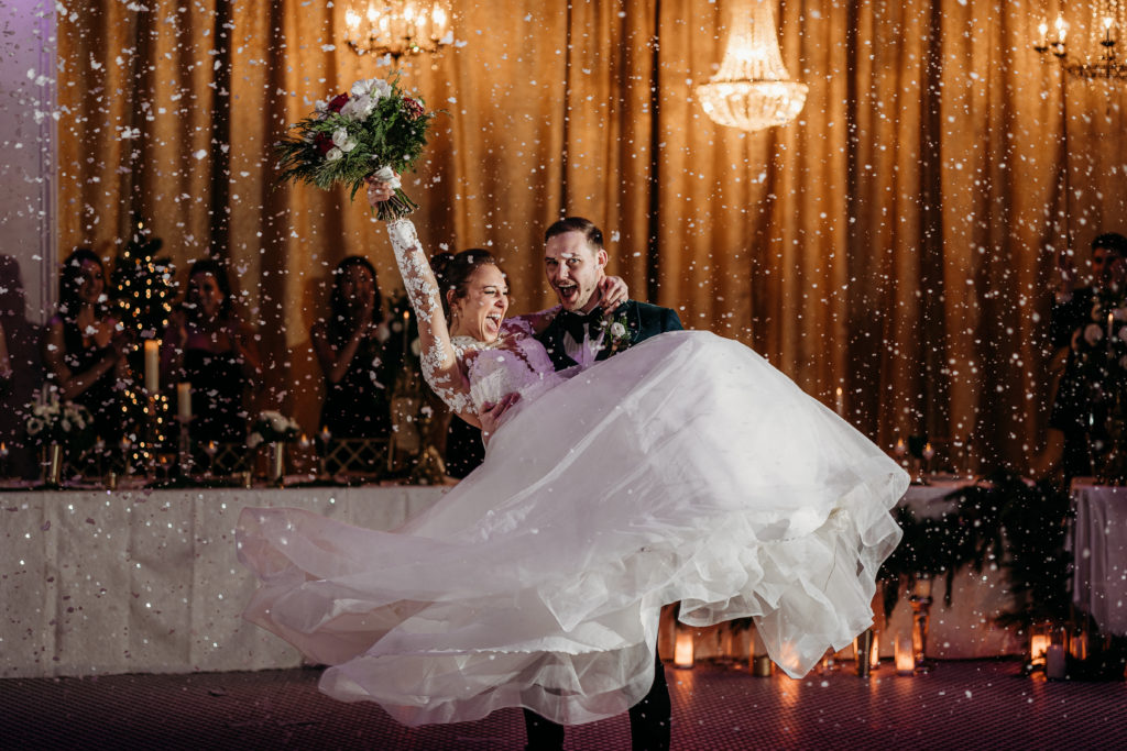 A snowy winter first dance at the Dayton Arcade mades any wedding feel magical. 
