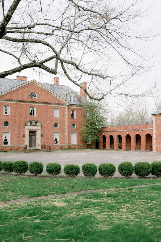 The Peterloon Estate with trees in front.