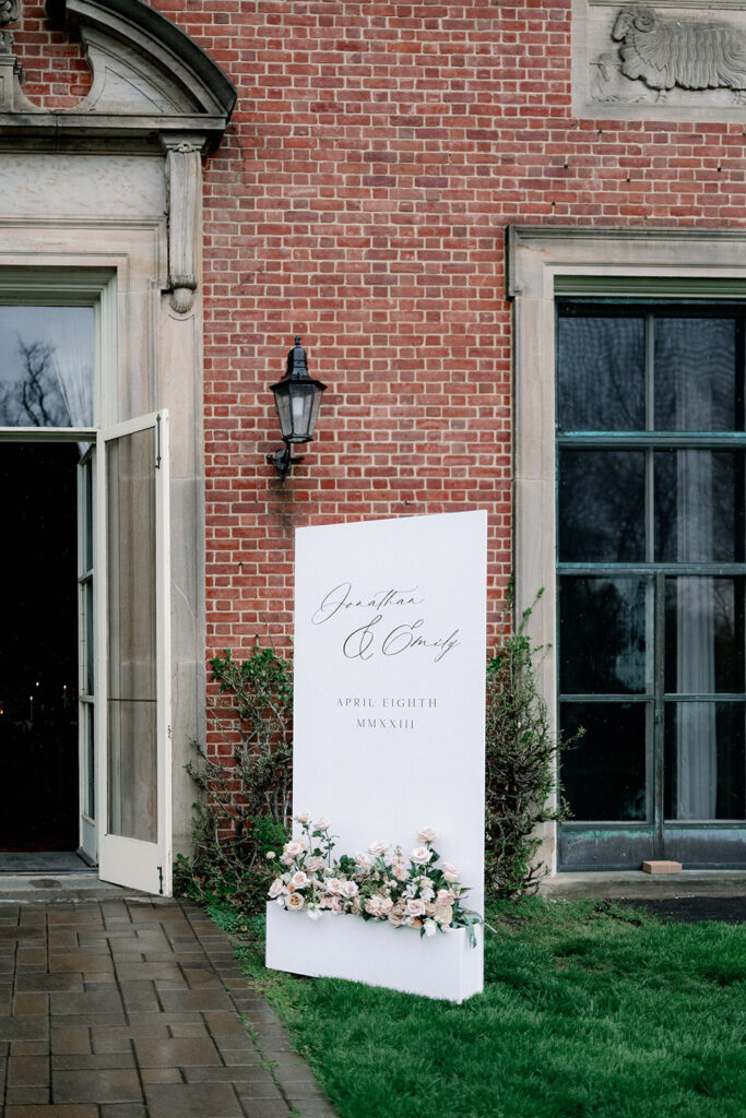 The side door at Peterloon Estate with a wedding welcome sign.
