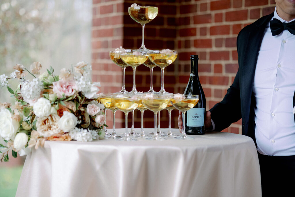 Champagne tower for couple to give toast. 