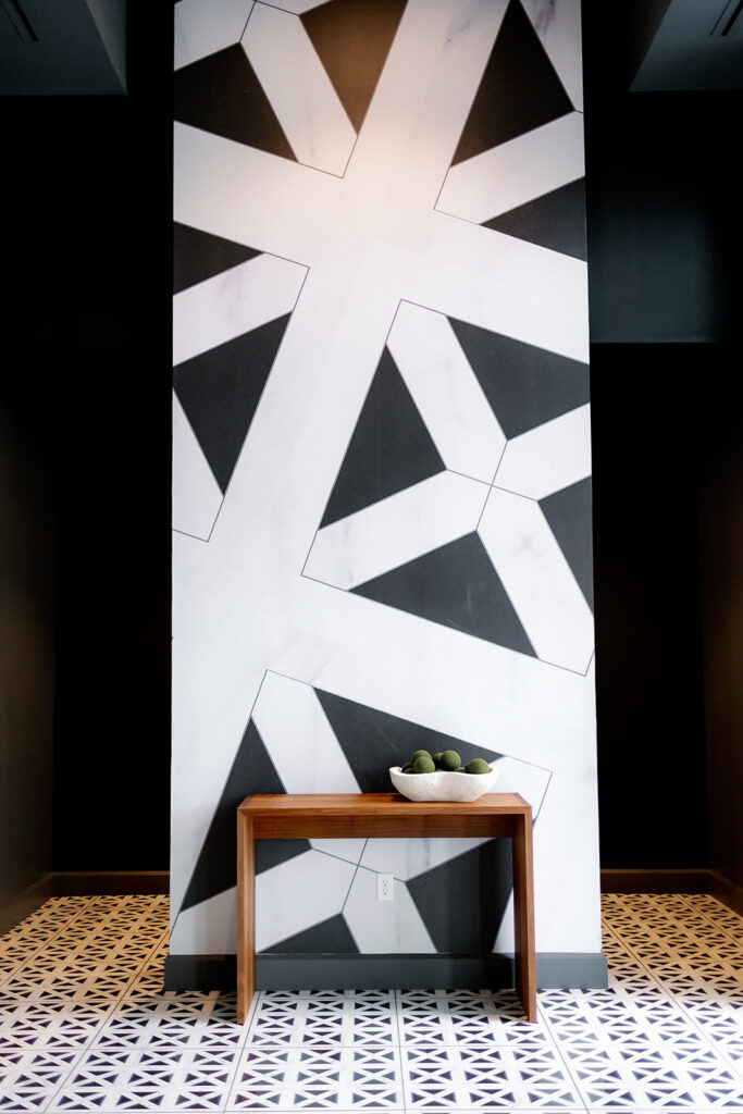 an accent wall in a hotel venue with black and white deco design