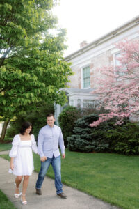 colorful spring engagement session of 2 people walking holding hands