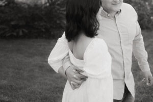 a couple holding hands during their spring engagement session