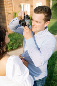 colorful image of couple taking pictures of each other during their spring engagement session