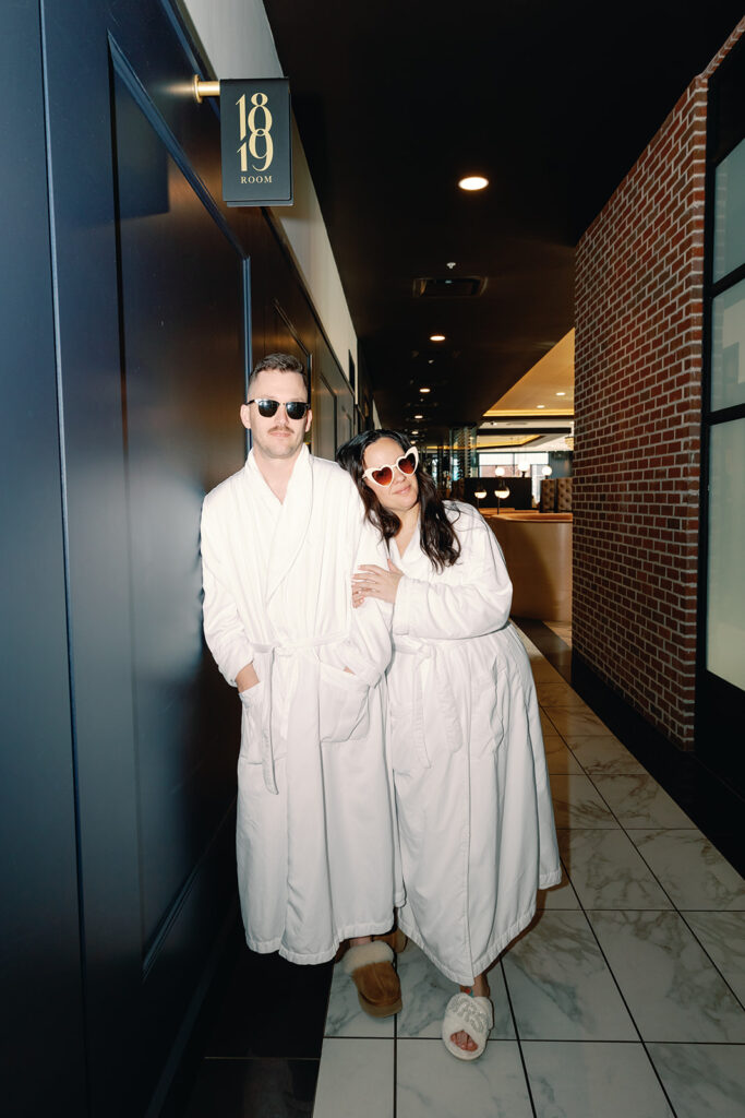 Bride and groom sporting robes for their intimate wedding at 1819 Hotel Versailles. 