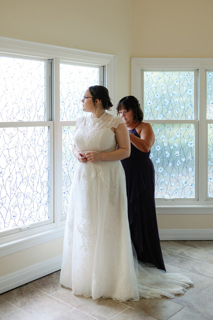 Bride getting ready in bridal suite at Estate at Sunset Farms.