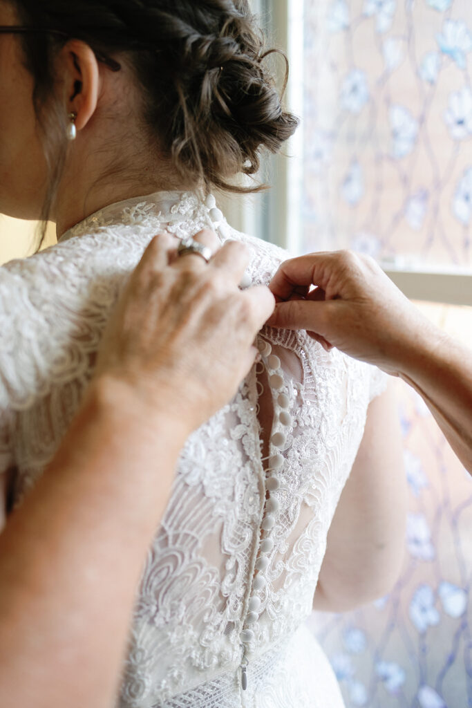 Bride getting ready in bridal suite at Estate at Sunset Farms.