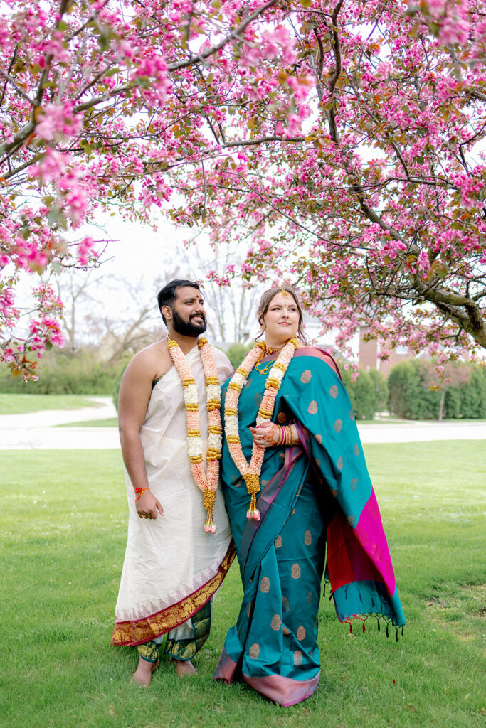 Bride and groom standing for portraits at an Indian Wedding.