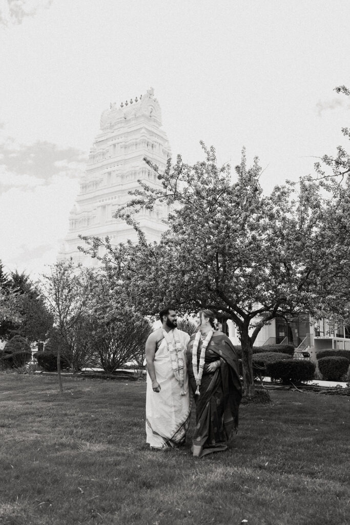 Bride and groom standing for portraits at an Indian Wedding.