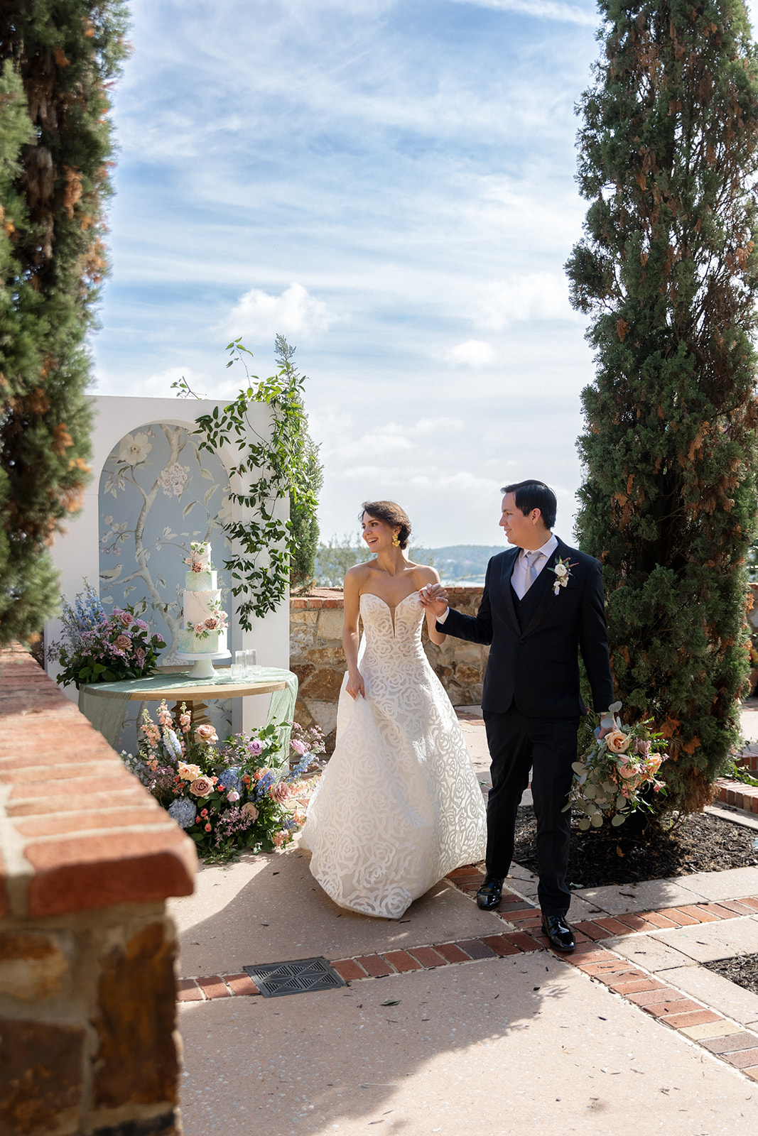 Bride and groom walking at Bella Collina