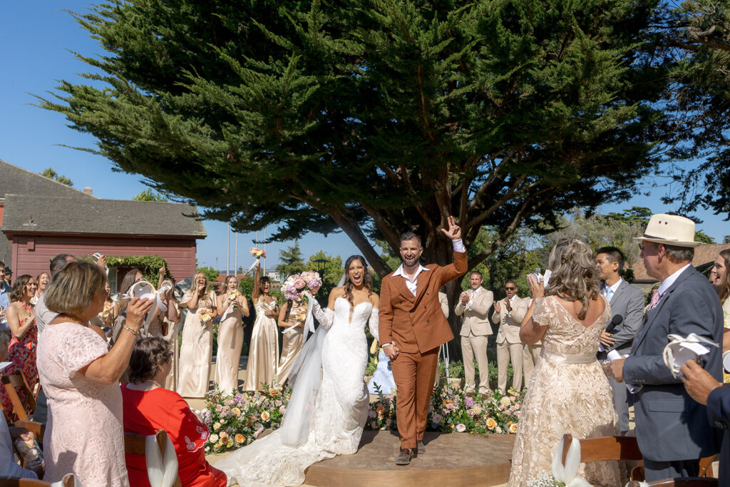 Wedding ceremony of couple getting married at Barns of Cooper Molera in Monterey California