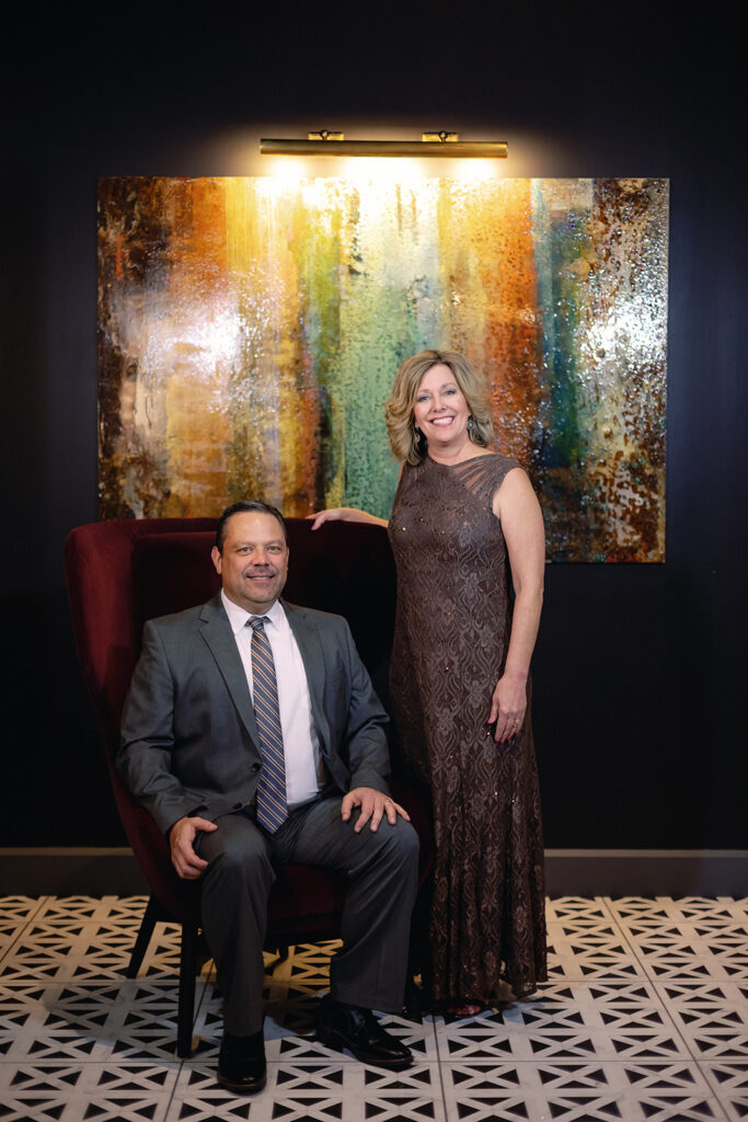 Guest posing for portrait as party favor of event.