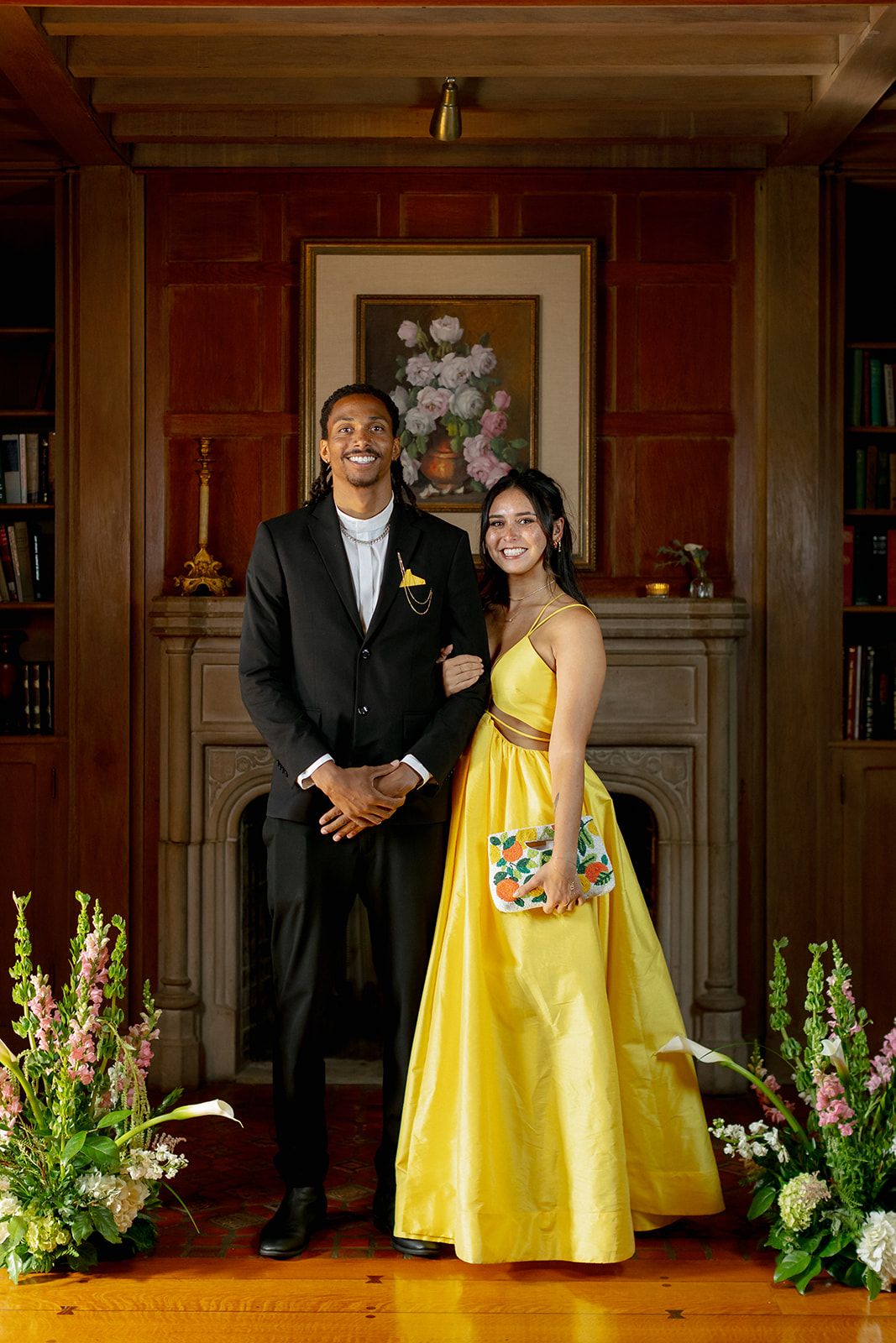 Couple posed wearing a brooch