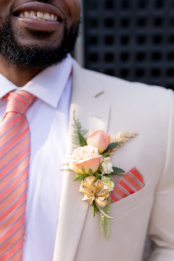 Close up of brooch on suit.